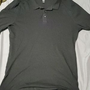 A black muscle fit polo